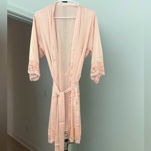 Brand new. Mother of the bride robe. Rose color with gold foil print. One size